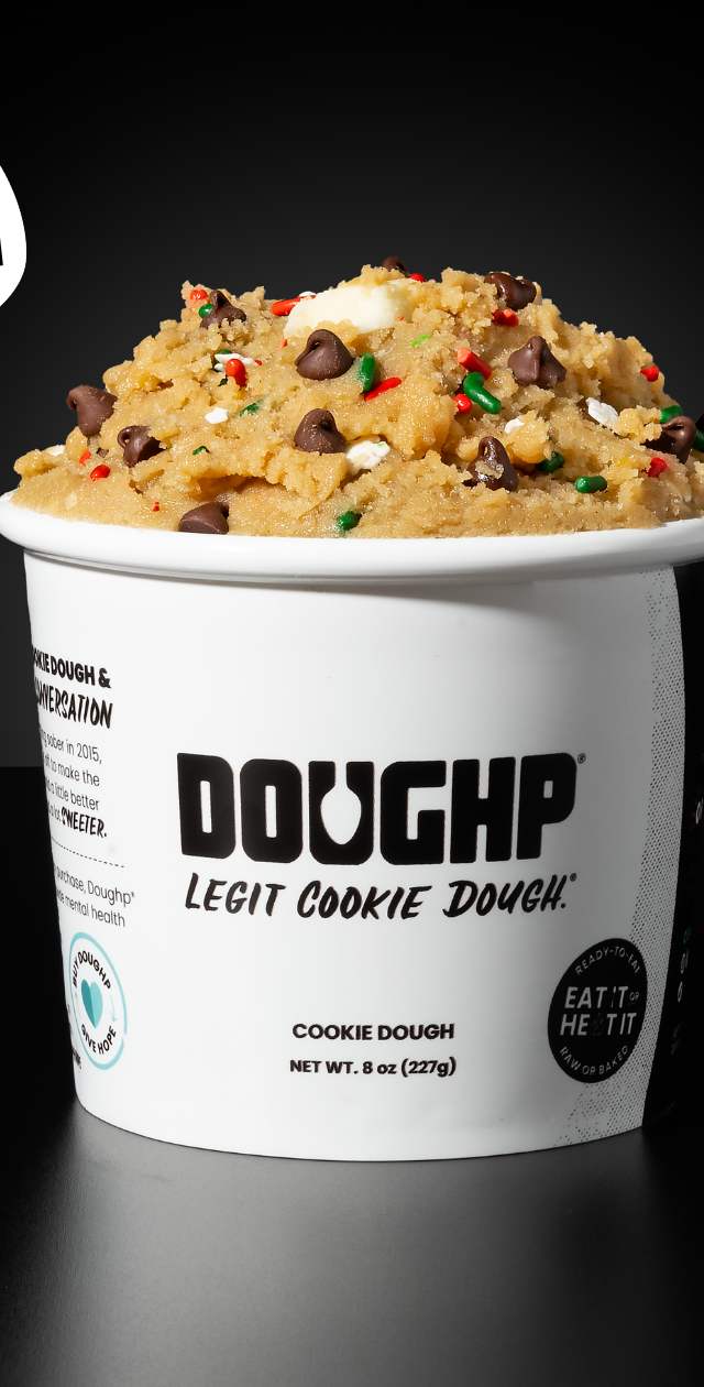 Close shot of Santa's Doughp cookie dough flavor displaying chocolate chips, festive sprinkles and milk "chunks"